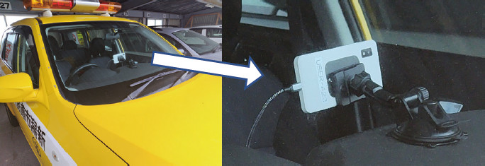 図－1　パトロール車に取り付けられたAIスマホ路面判定装置（北区）