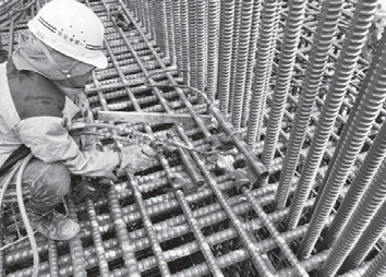 写真- 4 ガス圧接継手作業状況